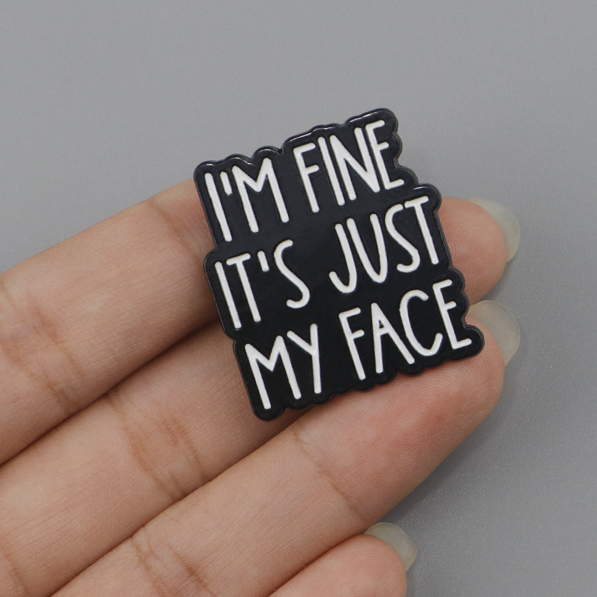 'I'm fine it's just my face' enamel pin