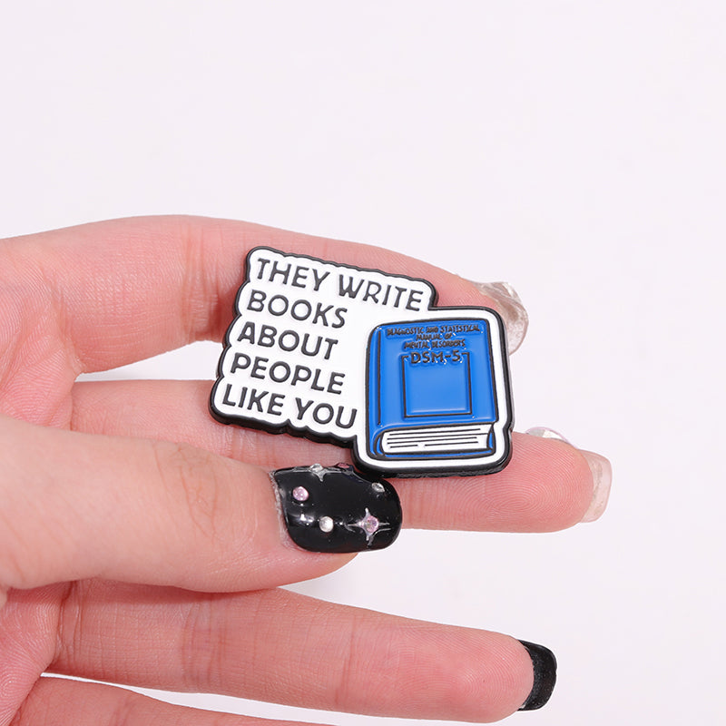 'They write books about people like you' enamel pin