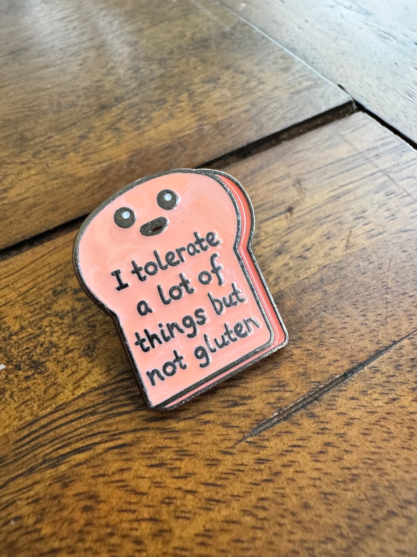 'I tolerate a lot of things but not gluten' enamel pin