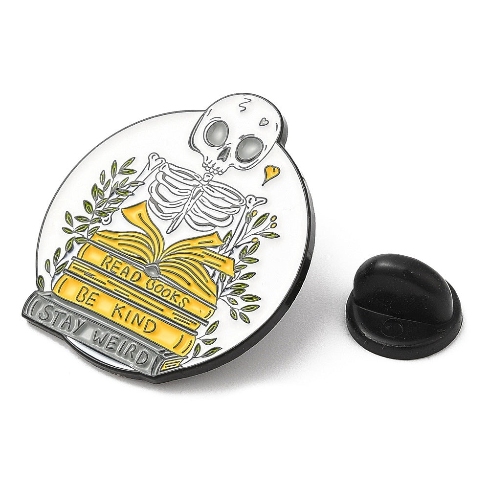 'Read books, be kind, stay weird' skeleton enamel pin