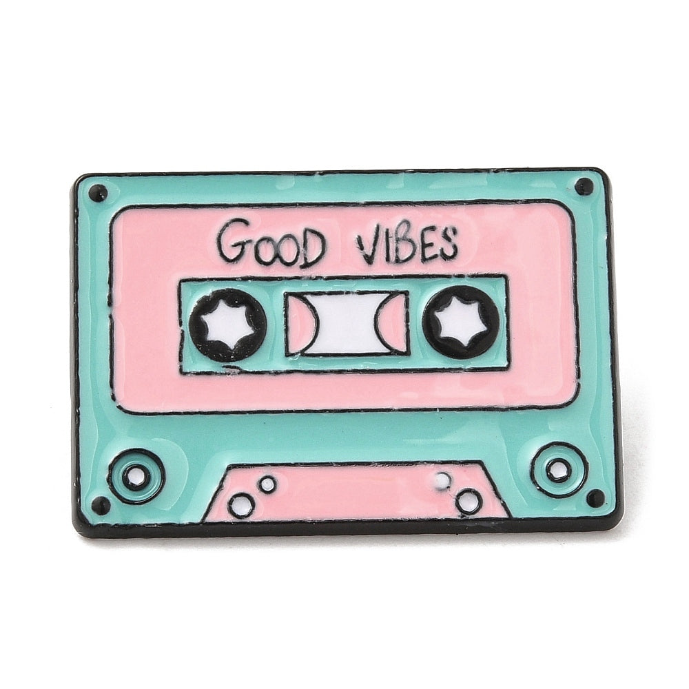 Cassette tape with 'good vibes' enamel pin