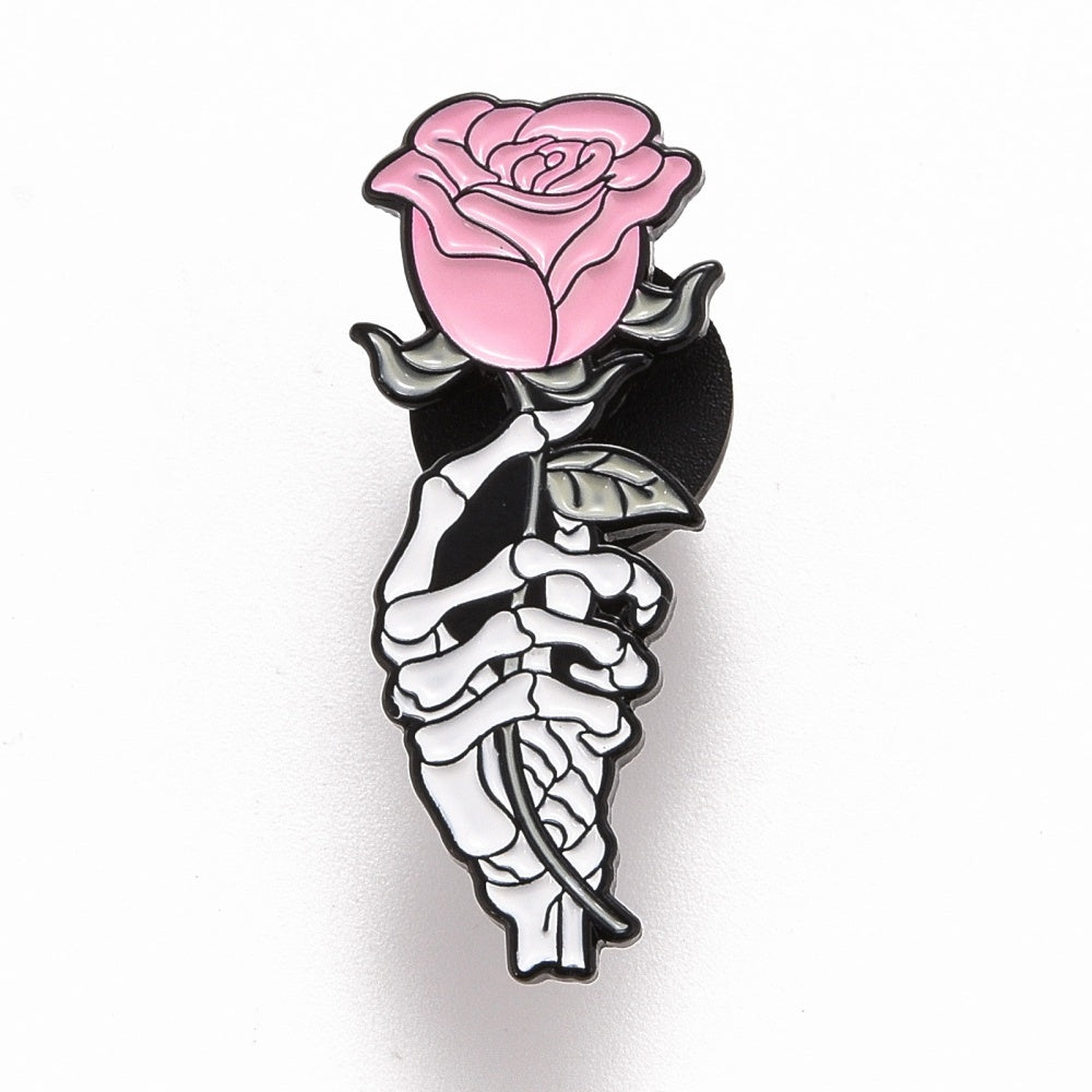 Skeleton rose hand enamel pin