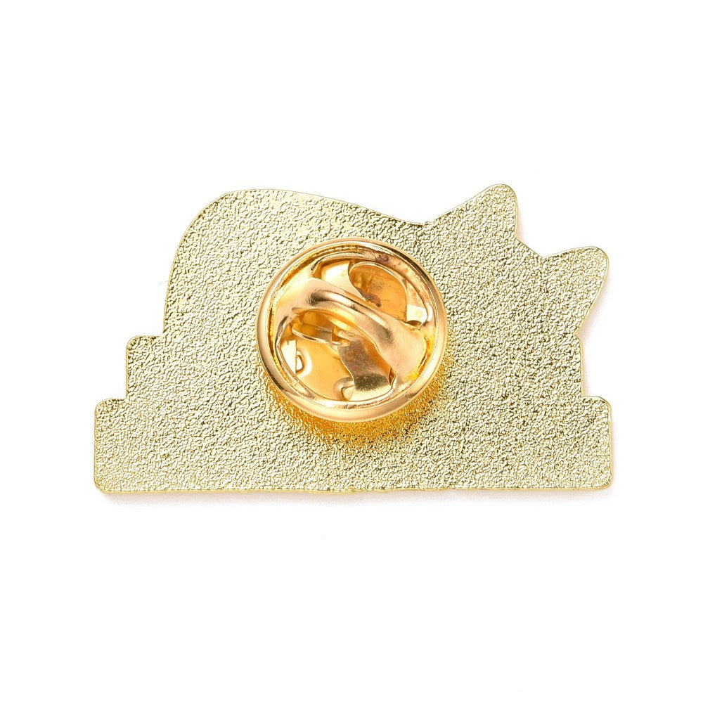 Cat sleeping on books enamel pin