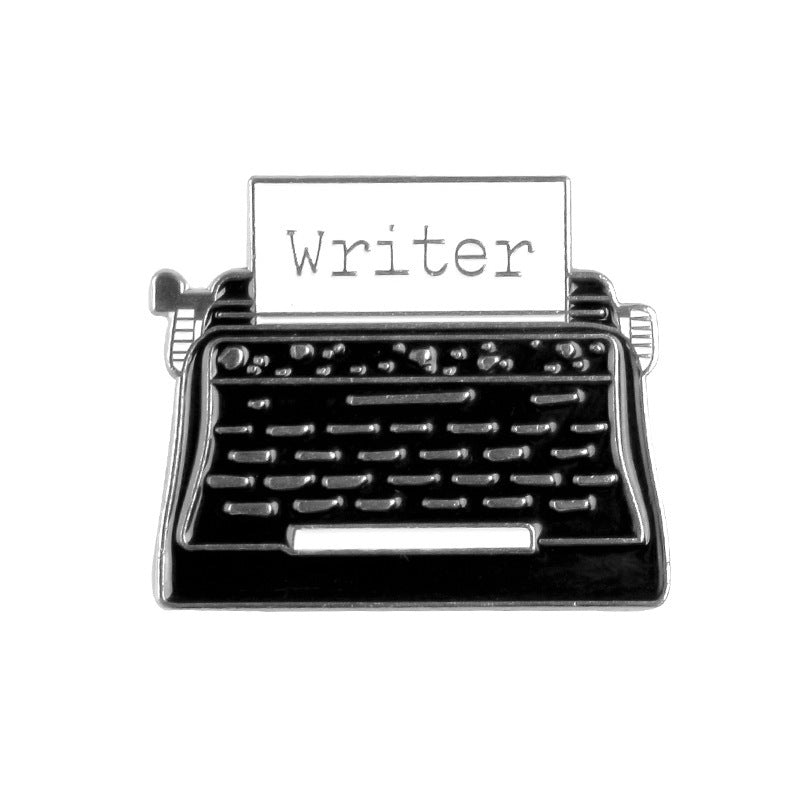Typewriter with 'writer' on the paper enamel pin