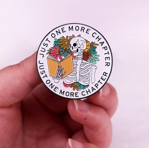 'Just one more chapter' enamel pin