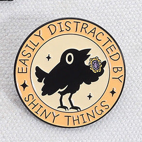 'Easily distracted by shiny things' enamel pin
