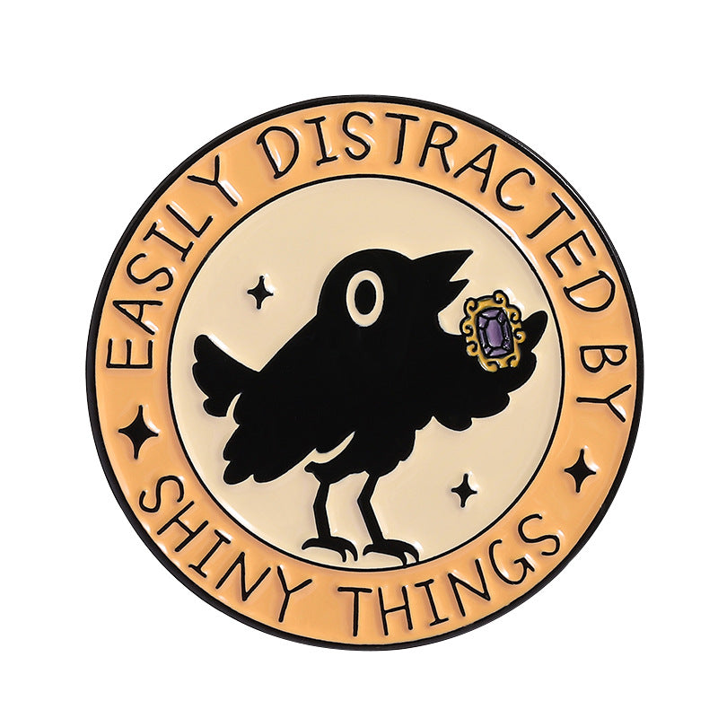 'Easily distracted by shiny things' enamel pin