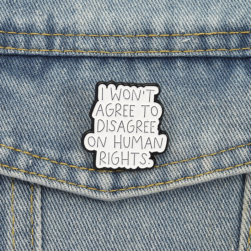 'I won't agree to disagree on human rights.' enamel pin
