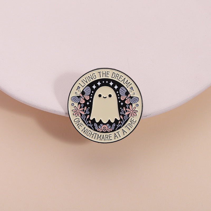 'Living the dream one nightmare at a time' enamel pin