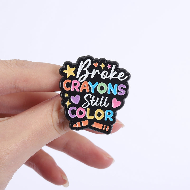 'Broke crayons still colour' enamel pin