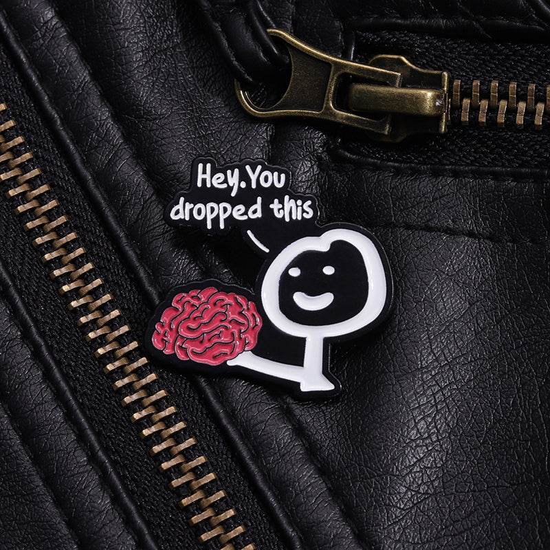 'Hey you dropped this' enamel pin