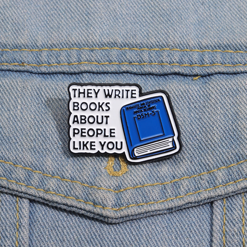 'They write books about people like you' enamel pin