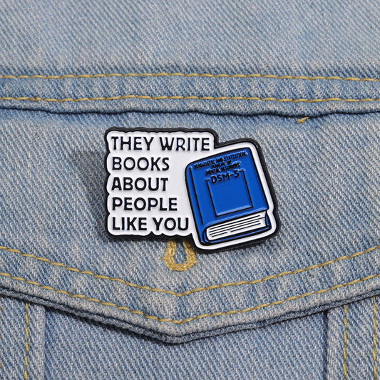 'They write books about people like you' enamel pin