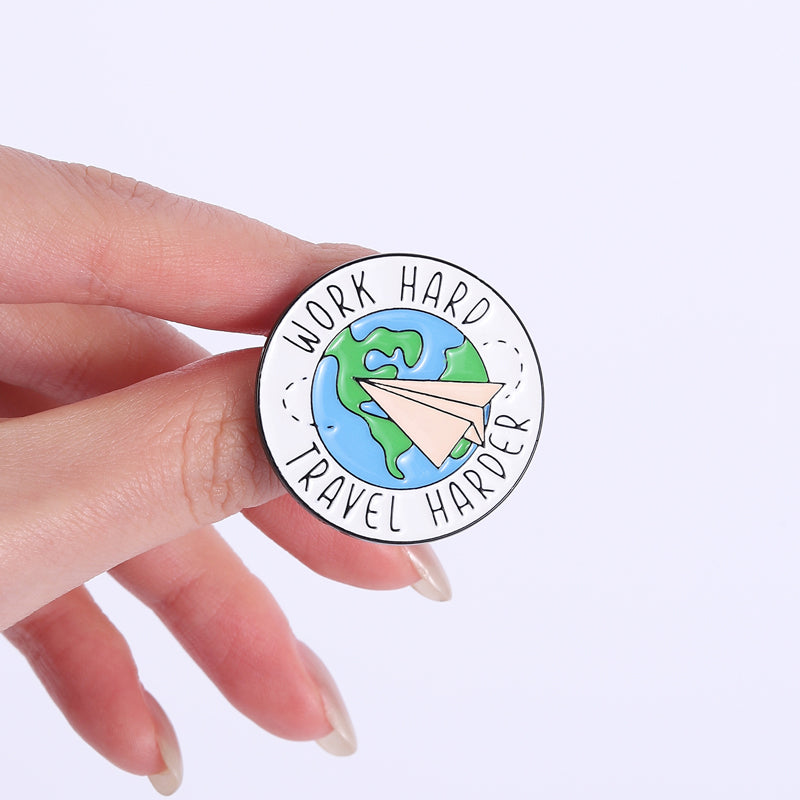 'Work hard travel harder' enamel pin