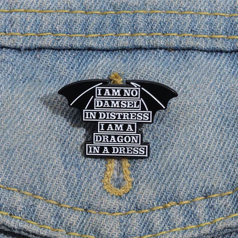 'I am no damsel in distress i am a dragon in a dress' enamel pin