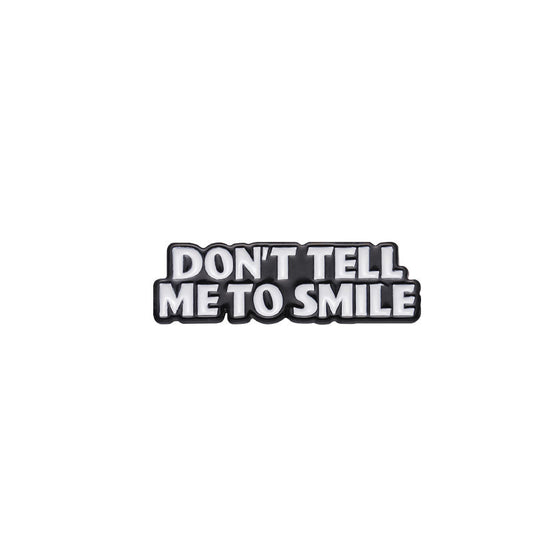 'Don't tell me to smile' enamel pin
