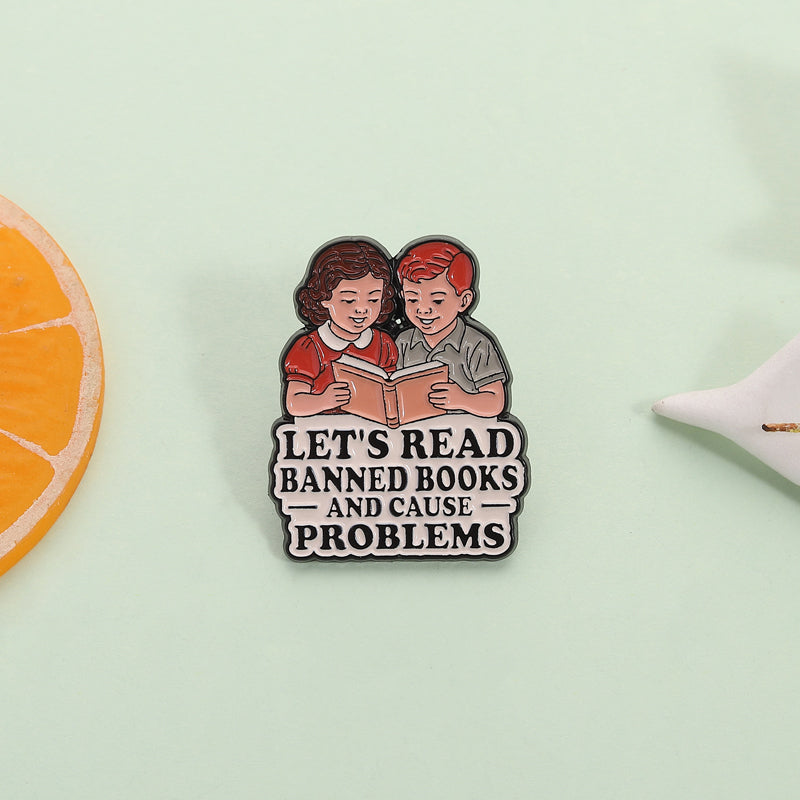 'Let's read banned books and cause trouble' enamel pin