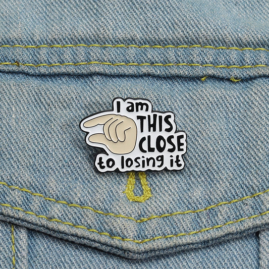 'I am this close to losing it' enamel pin