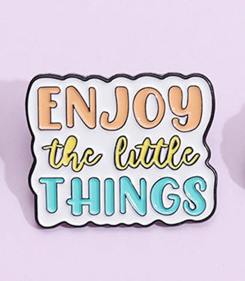 'Enjoy the little things' enamel pin