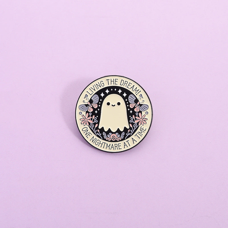 'Living the dream one nightmare at a time' enamel pin