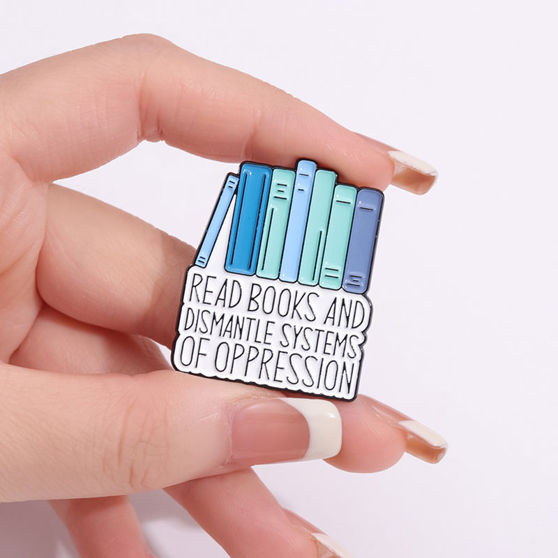 'Read books and dismantle systems of oppression' enamel pin