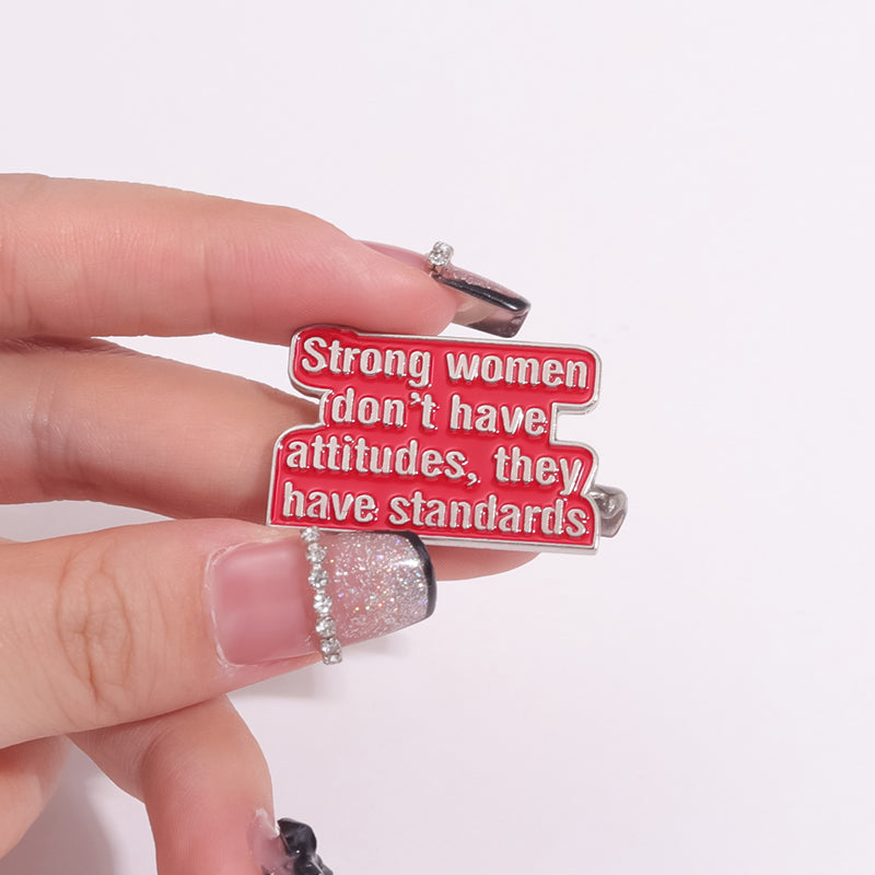 'Strong women don't have attitudes, they have standards' enamel pin