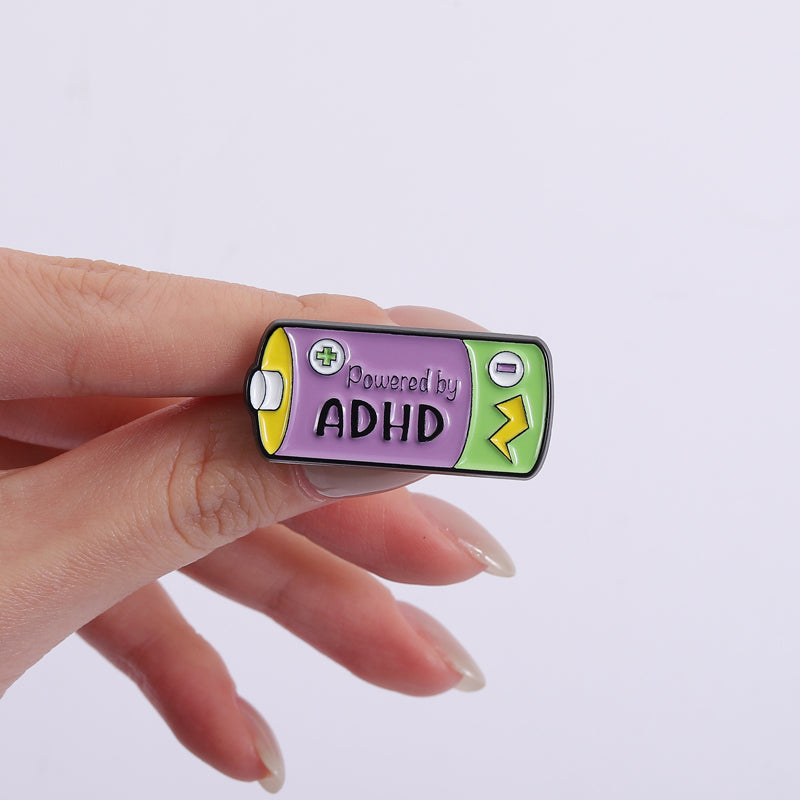 'Powered by ADHD' enamel pin