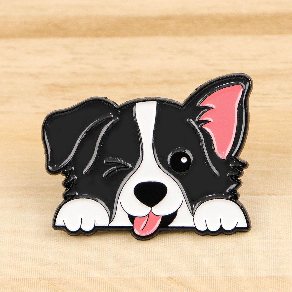 Black and white dog enamel pin