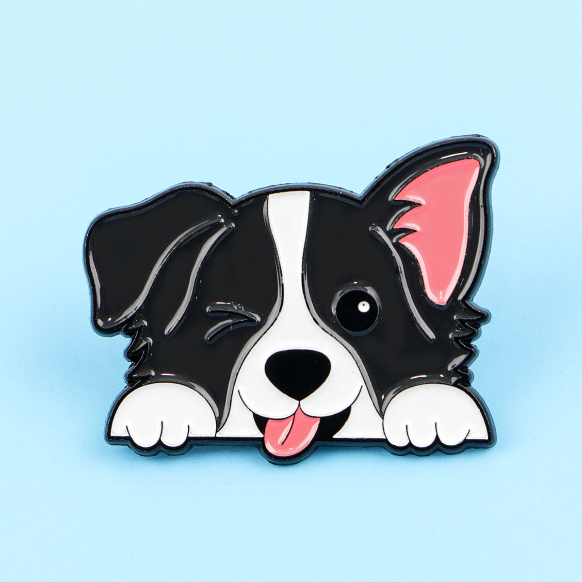 Black and white dog enamel pin