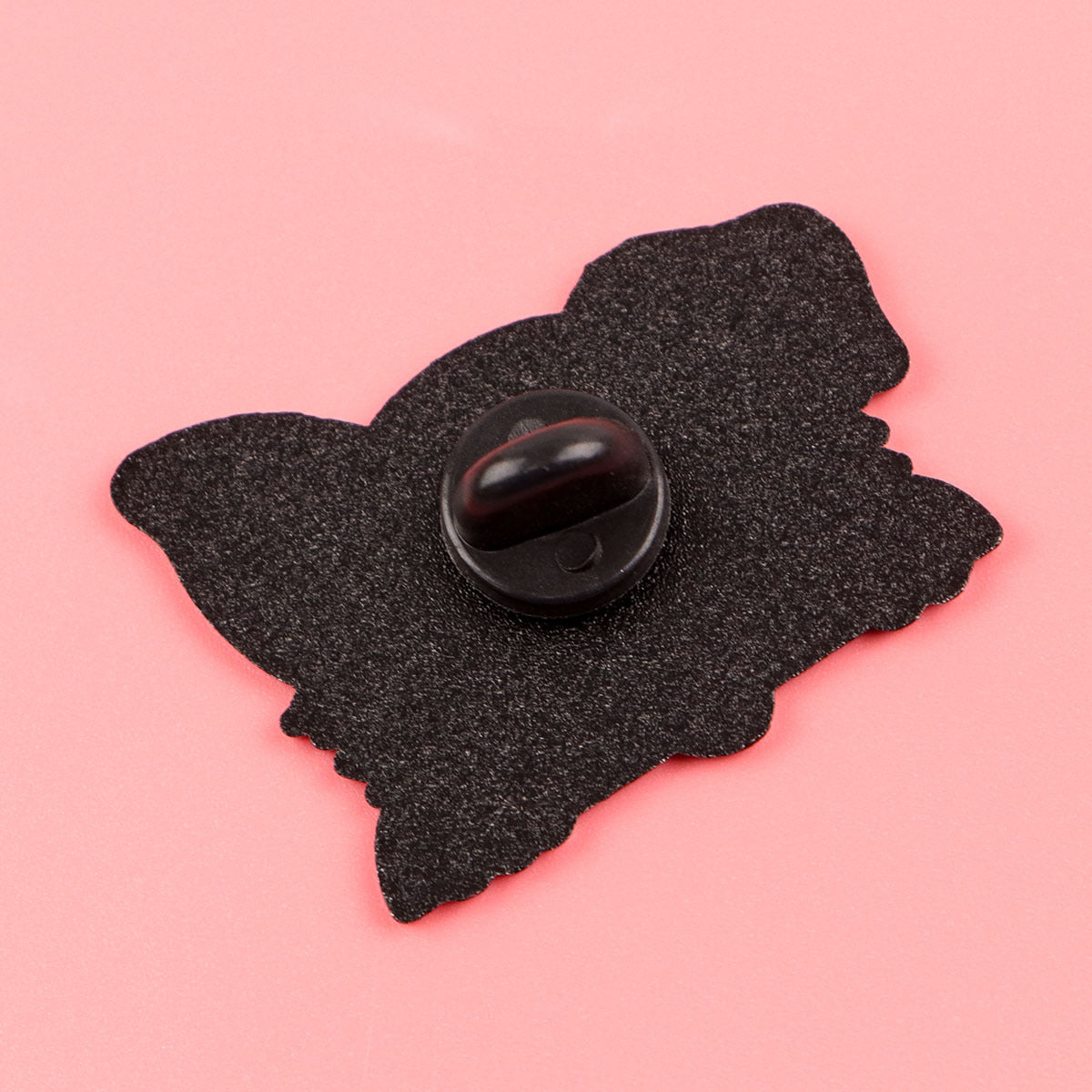 Black and white dog enamel pin