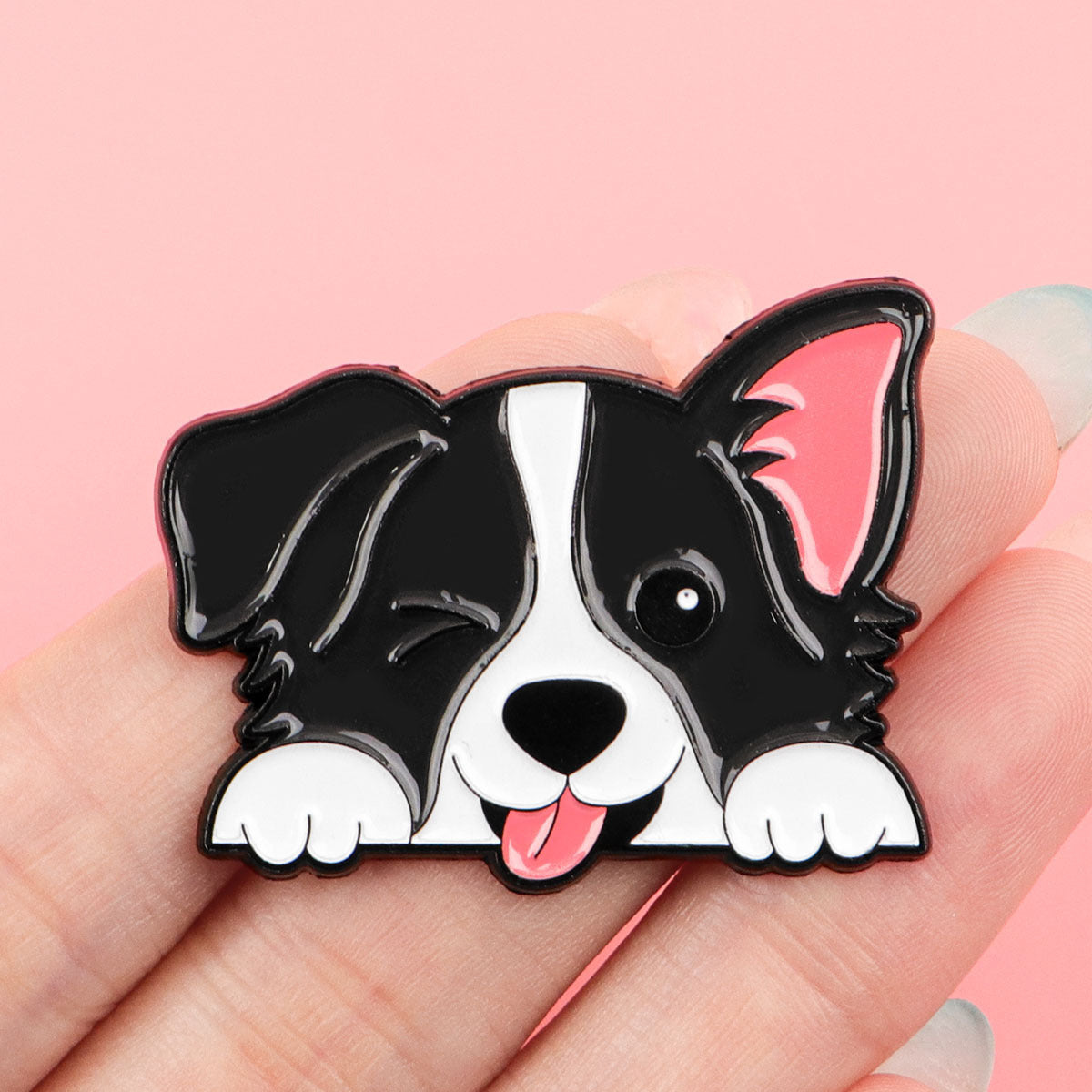 Black and white dog enamel pin